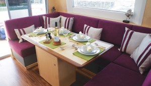 Alcantara 'Ruby Red' upholstery with grey fabric panelling on the settee fronts