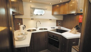 The 50's galley is comprehensively equipped, with plenty of workspace and lots of stowage, including a vast larder locker opposite